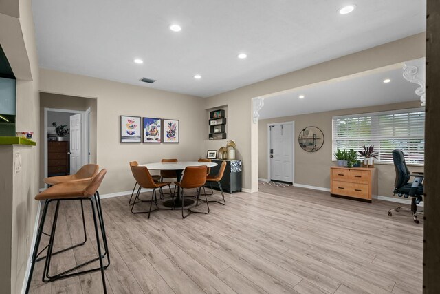 dining space with light wood-type flooring