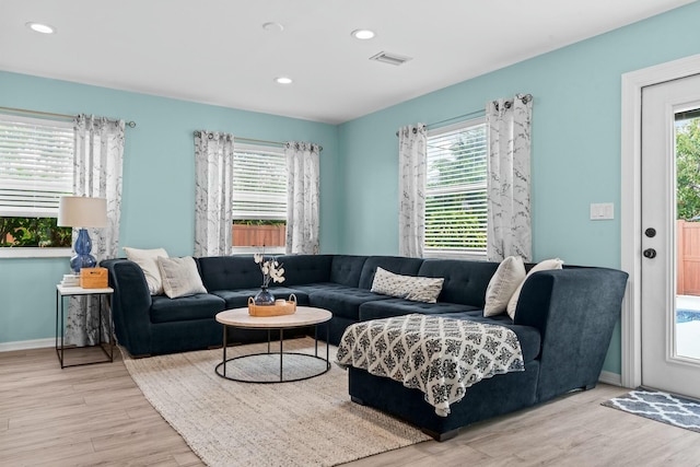 living room with light hardwood / wood-style floors