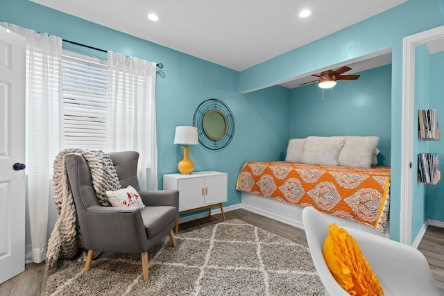 bedroom with hardwood / wood-style flooring and ceiling fan