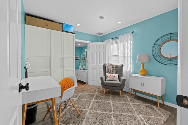 sitting room featuring hardwood / wood-style floors