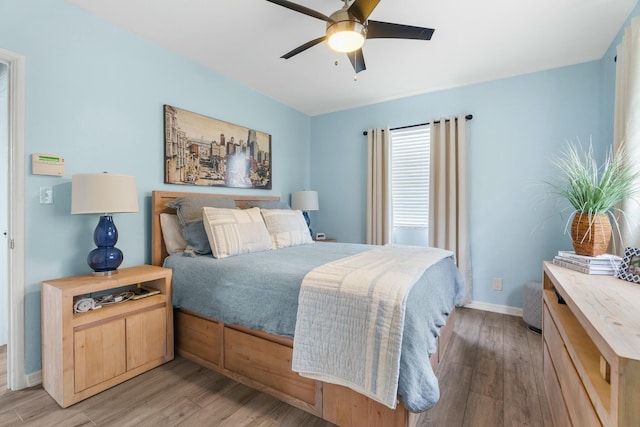 bedroom featuring ceiling fan and light hardwood / wood-style floors