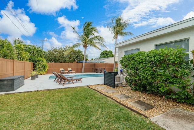 view of yard featuring a fenced in pool and a patio area