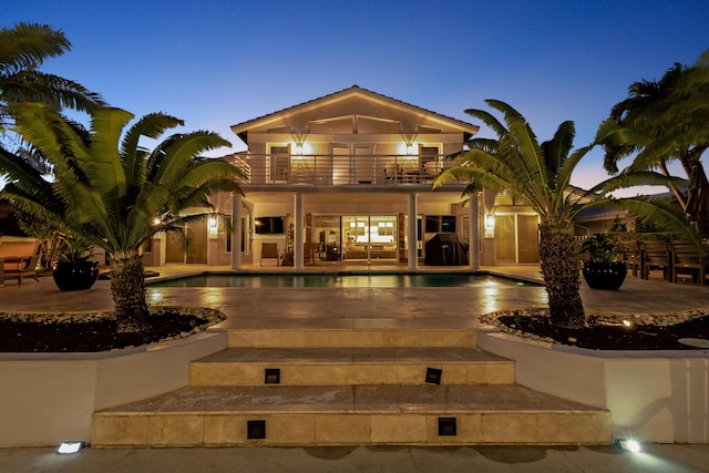 exterior space featuring a patio area and a balcony