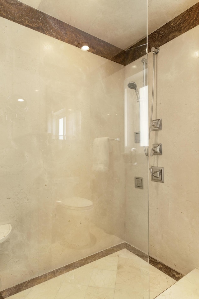 bathroom with a tile shower