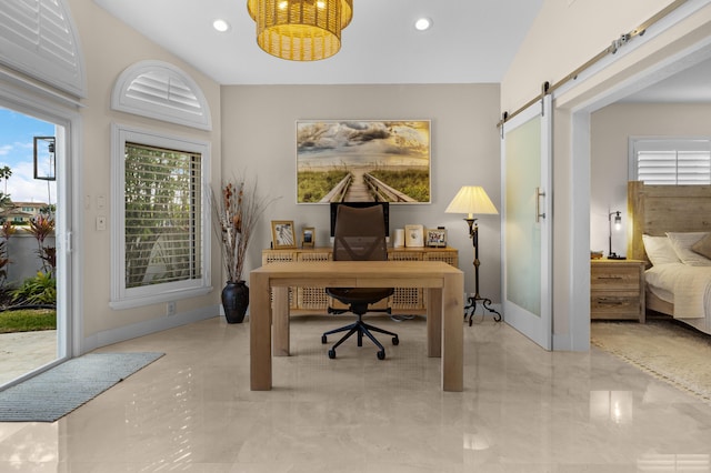 home office featuring a barn door