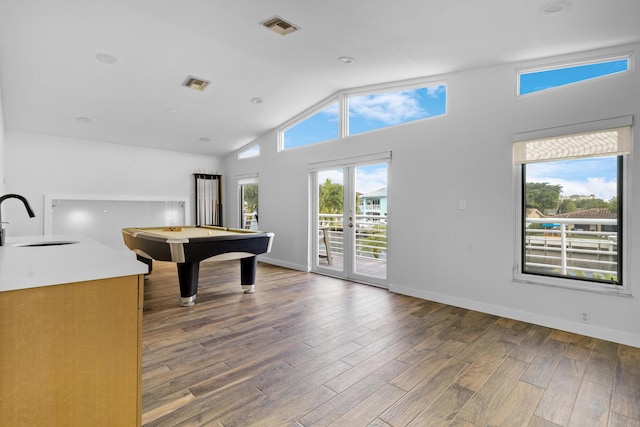 playroom with plenty of natural light, dark hardwood / wood-style floors, sink, and billiards