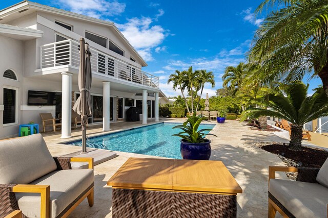 view of swimming pool featuring a patio area