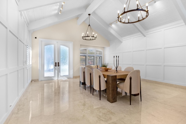 dining space featuring french doors, track lighting, lofted ceiling with beams, an inviting chandelier, and wooden ceiling