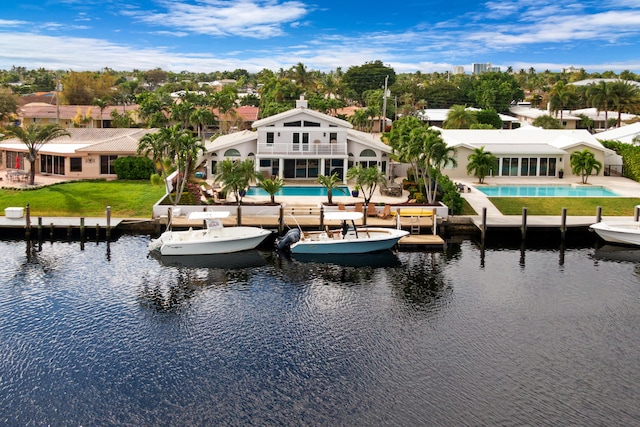 birds eye view of property with a water view