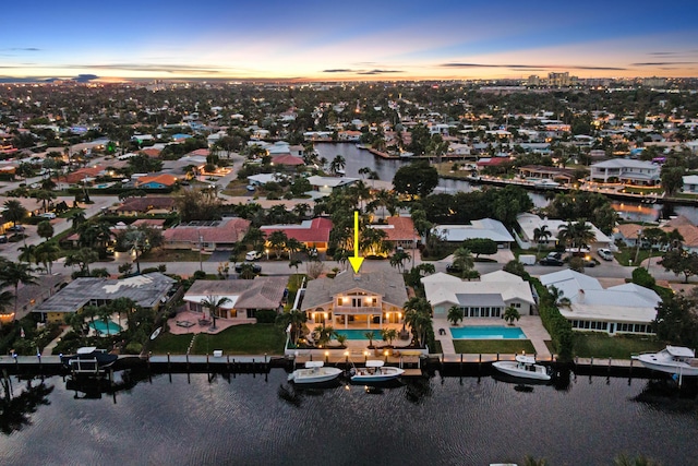 aerial view at dusk with a water view