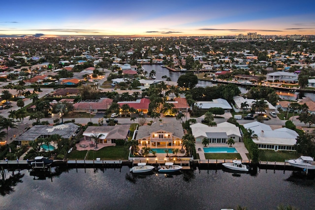 aerial view at dusk with a water view