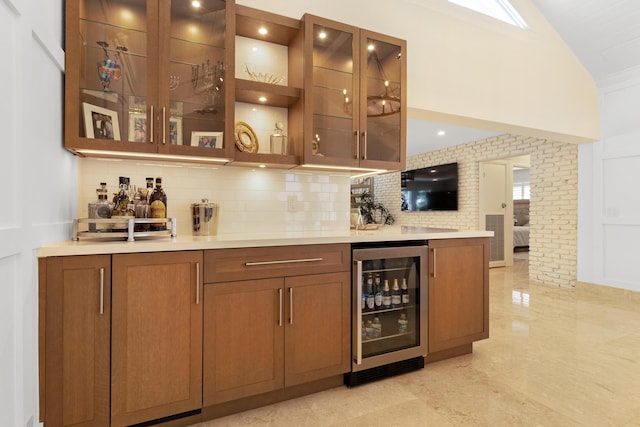 bar featuring decorative backsplash and wine cooler