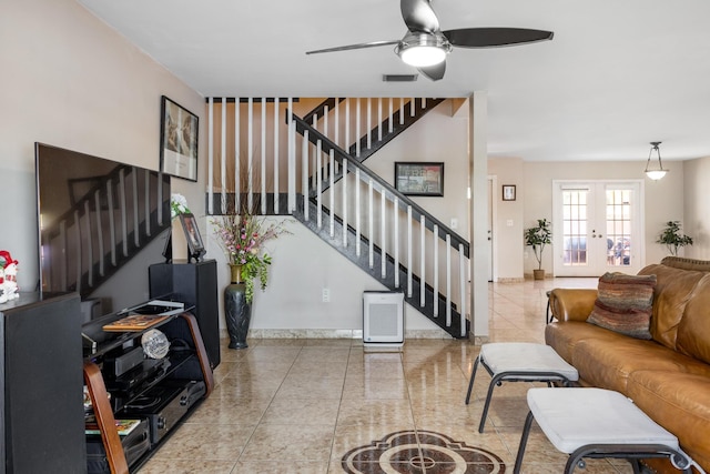 living room with ceiling fan and french doors