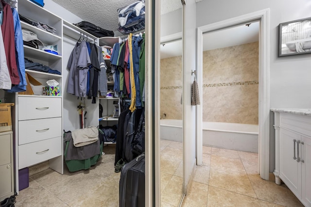 walk in closet featuring light tile patterned floors