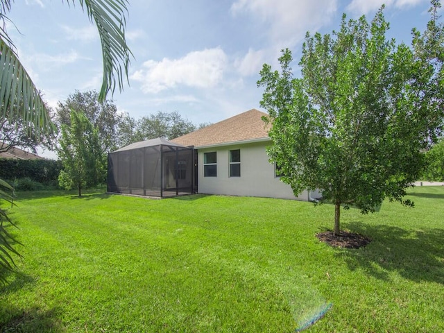 view of yard featuring a lanai