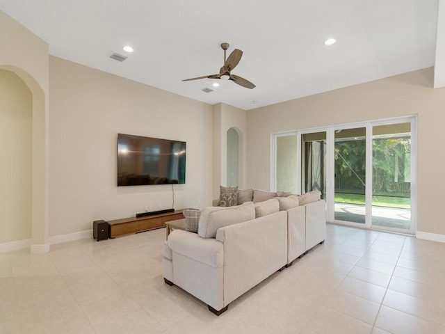 tiled living room featuring ceiling fan