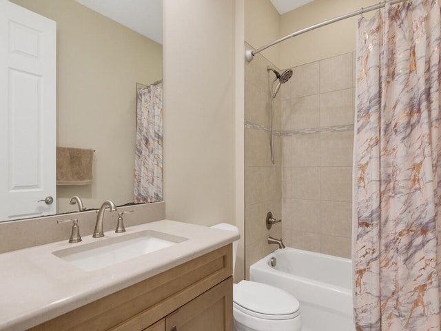 full bathroom featuring vanity, shower / bath combination with curtain, and toilet