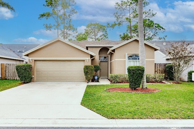 single story home featuring a garage and a front lawn