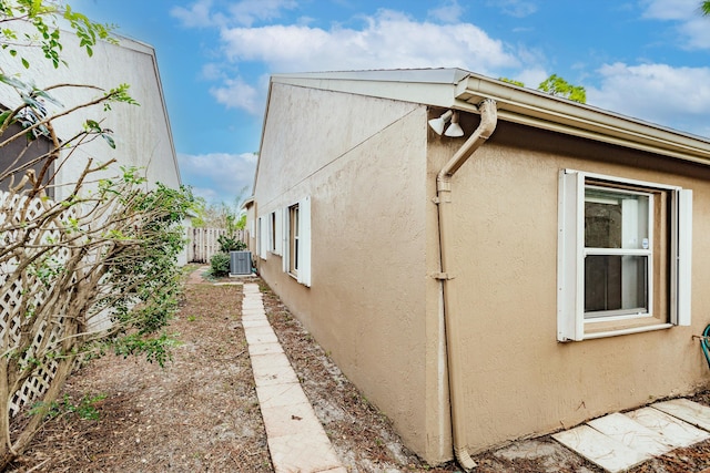 view of home's exterior with central AC