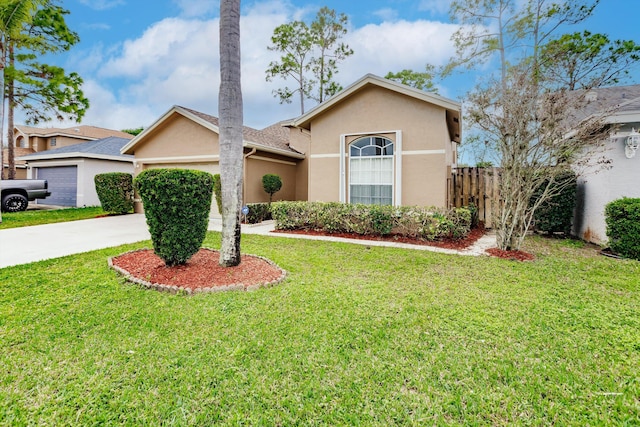 view of front of property featuring a garage and a front yard