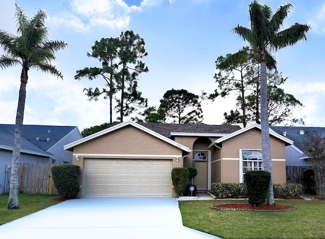 single story home with a garage and a front lawn