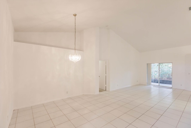 unfurnished room with a notable chandelier, high vaulted ceiling, and light tile patterned floors