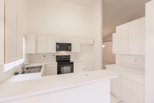 kitchen featuring white cabinetry, sink, backsplash, light tile patterned floors, and black appliances