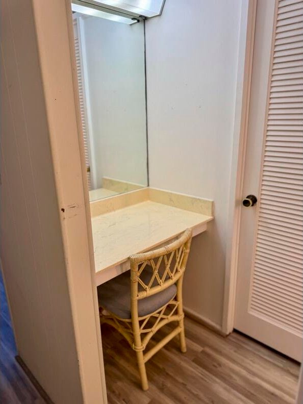 bathroom with wood-type flooring