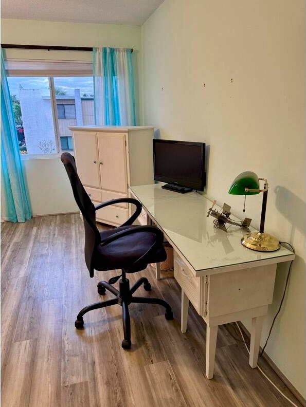 office space with light hardwood / wood-style flooring