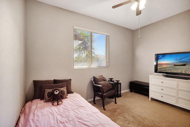 bedroom with light colored carpet and ceiling fan