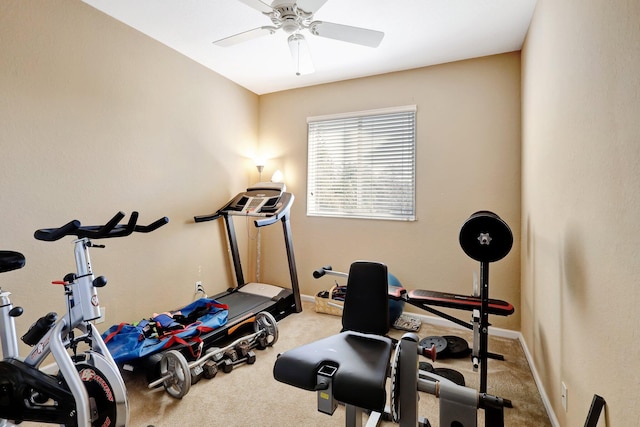 workout room featuring light carpet and ceiling fan