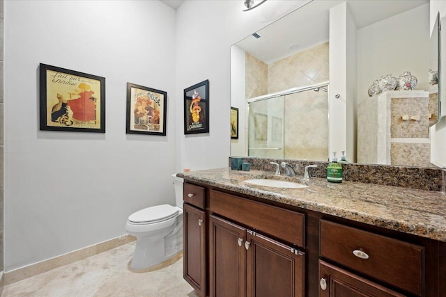 bathroom with tile patterned flooring, vanity, toilet, and a shower with shower door