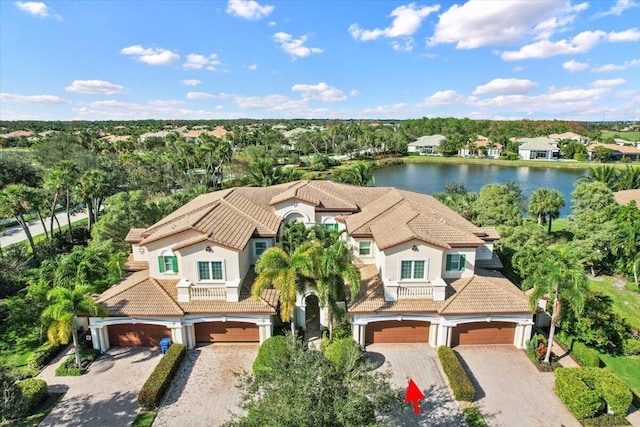 birds eye view of property with a water view