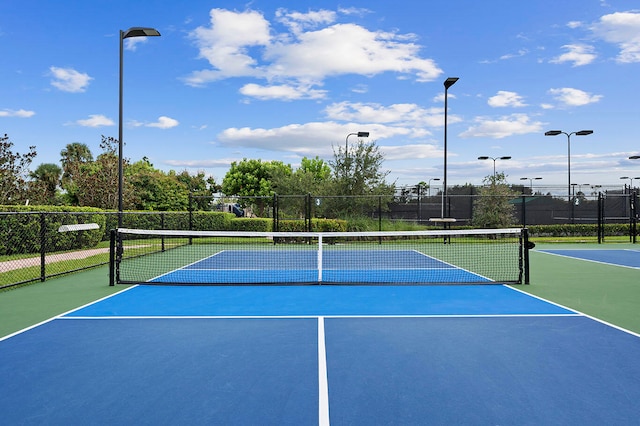 view of tennis court with basketball court