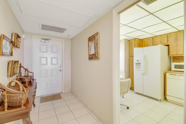 doorway to outside featuring light tile patterned floors