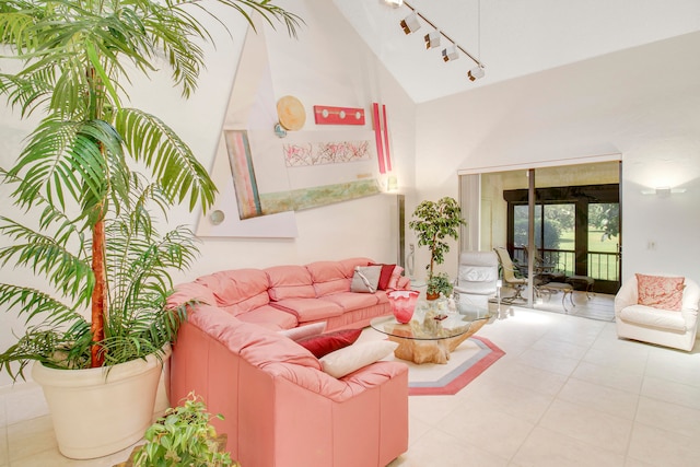 living room featuring light tile patterned floors and vaulted ceiling