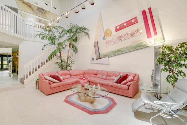 tiled living room featuring a towering ceiling