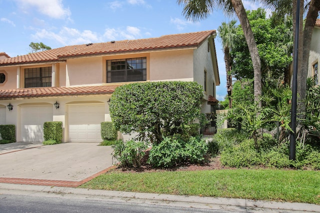 mediterranean / spanish-style house featuring a garage