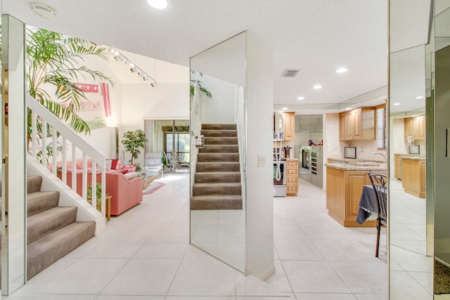 staircase with tile patterned flooring