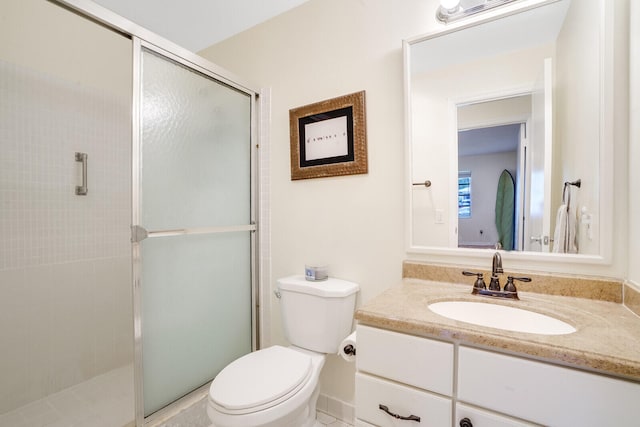 bathroom featuring vanity, toilet, and walk in shower