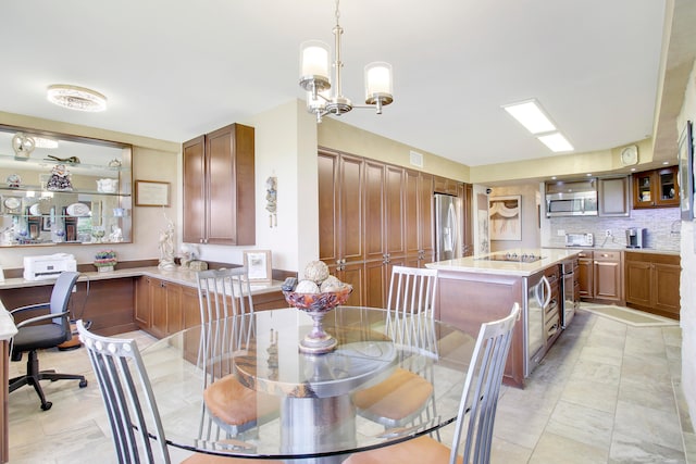 dining room featuring light tile patterned floors and an inviting chandelier