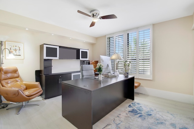 office space with ceiling fan and light wood-type flooring