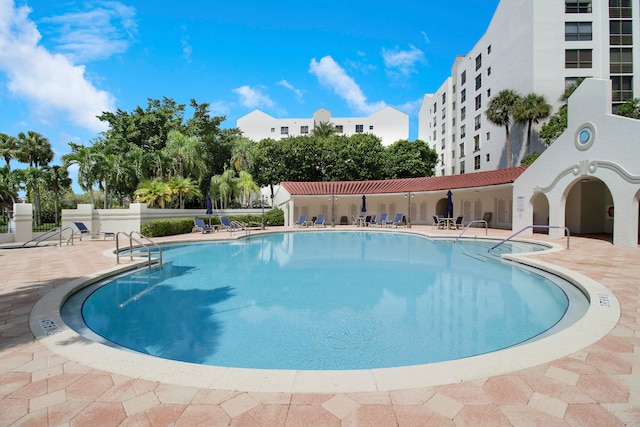 view of swimming pool featuring a patio area