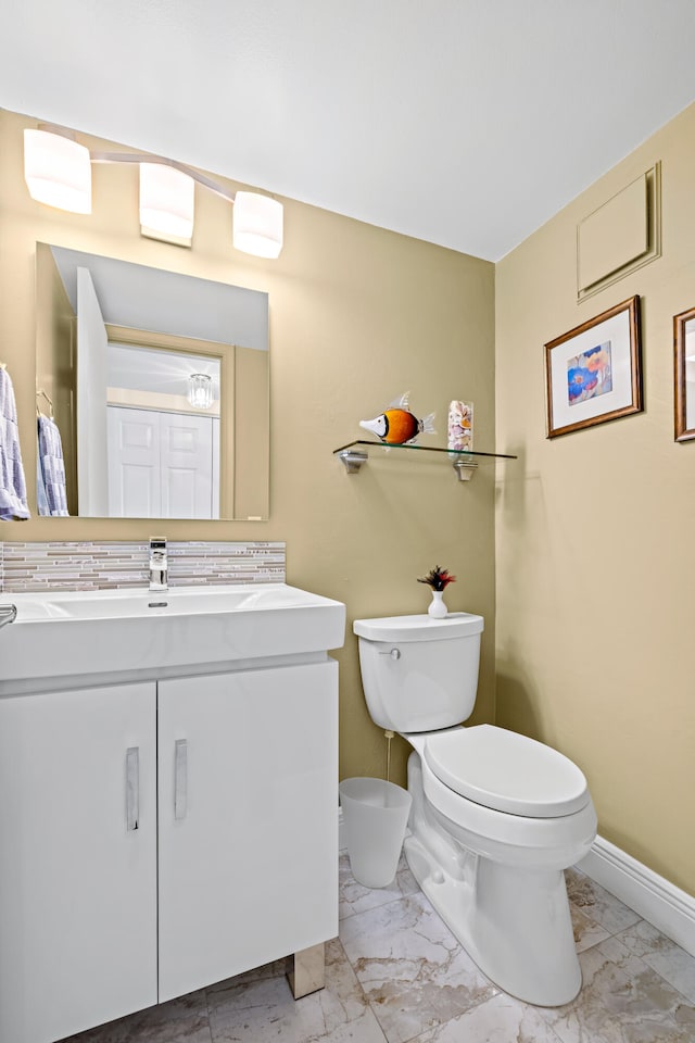 bathroom featuring vanity and toilet