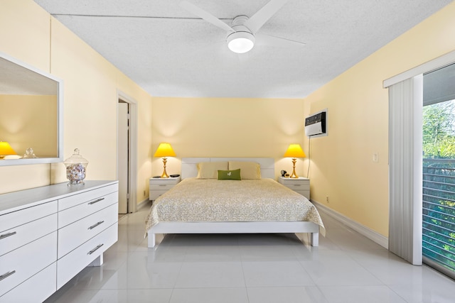 bedroom with ceiling fan and a textured ceiling