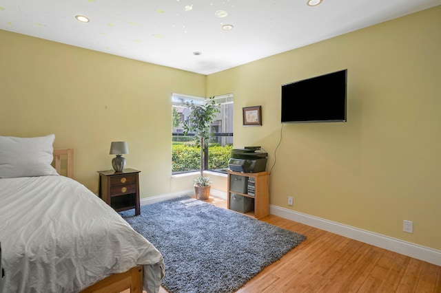 bedroom featuring wood-type flooring