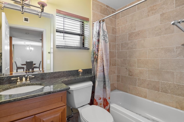 full bathroom featuring vanity, toilet, and shower / tub combo with curtain