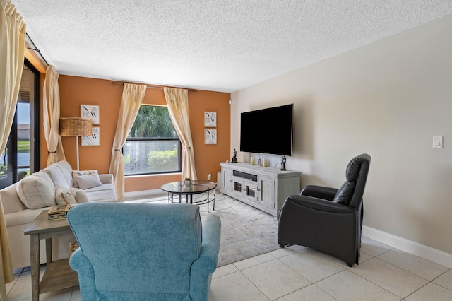 living room with light tile patterned flooring and a textured ceiling