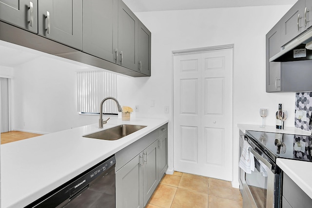 kitchen with gray cabinetry, dishwasher, electric stove, sink, and light tile patterned flooring