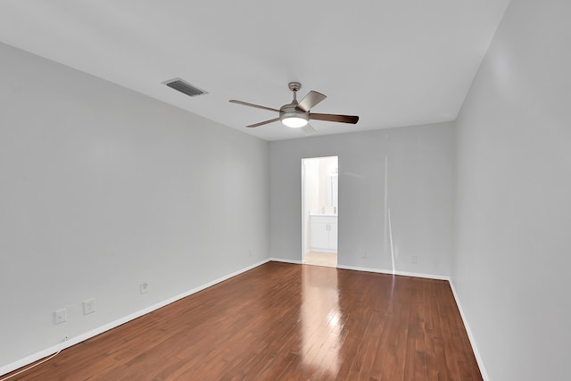 spare room featuring hardwood / wood-style flooring and ceiling fan